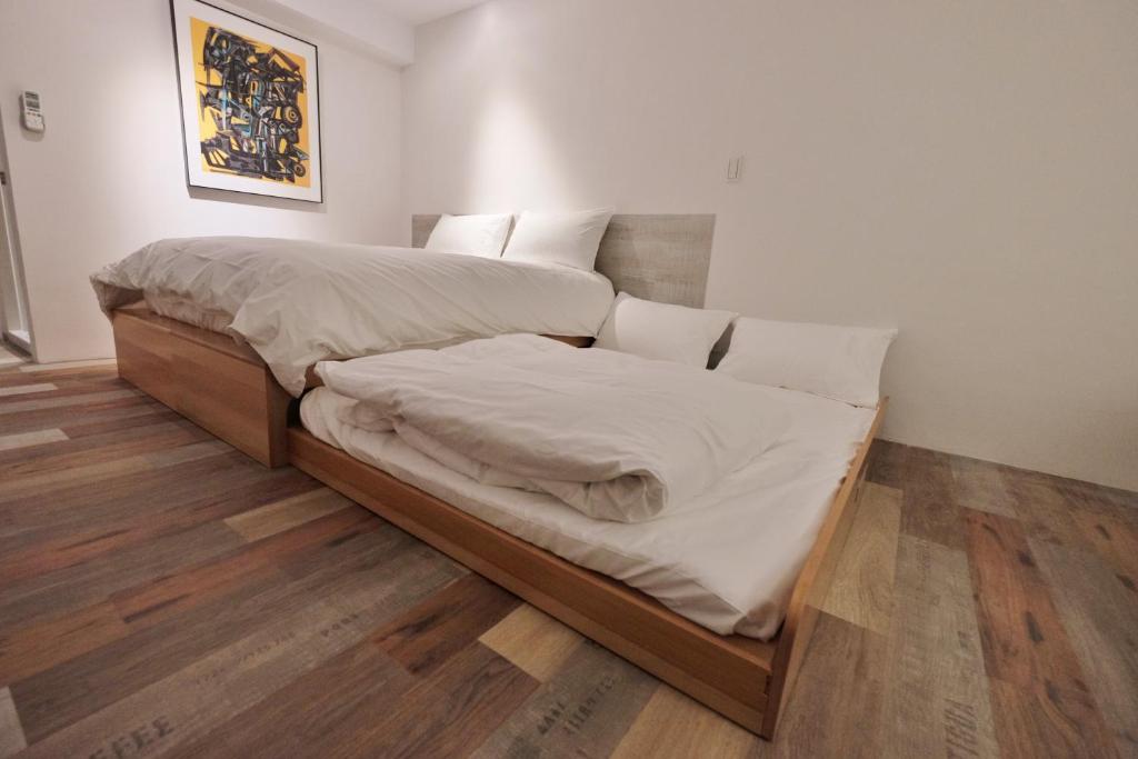 Postel nebo postele na pokoji v ubytování Happy Inn