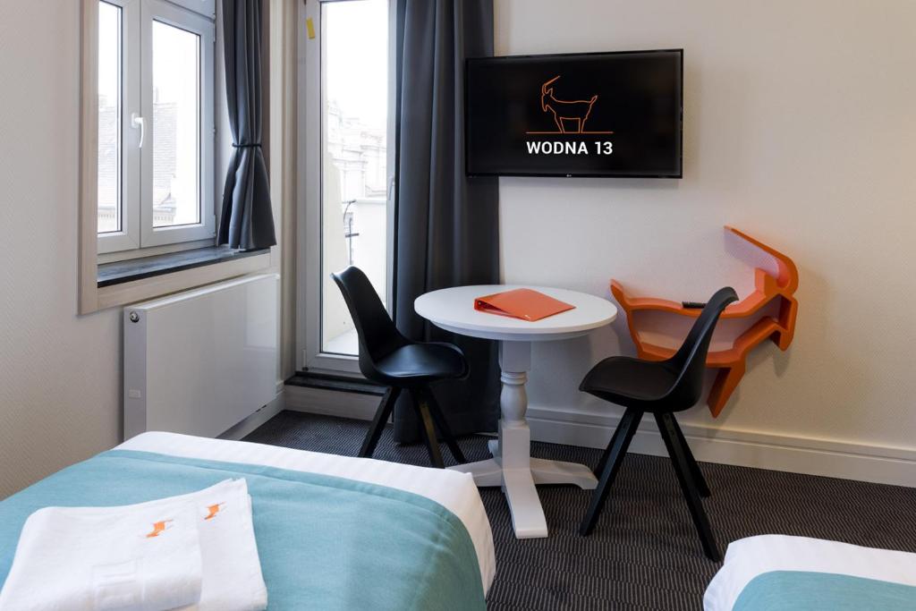 Posteľ alebo postele v izbe v ubytovaní Apartamenty Wodna 13