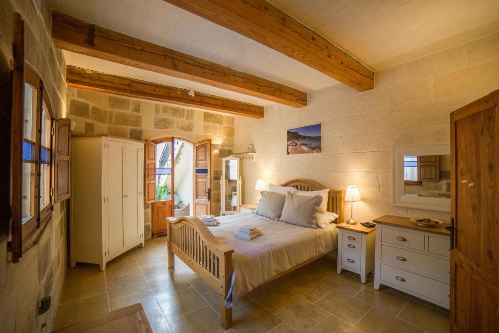 Cama o camas de una habitación en Gozo Spirit