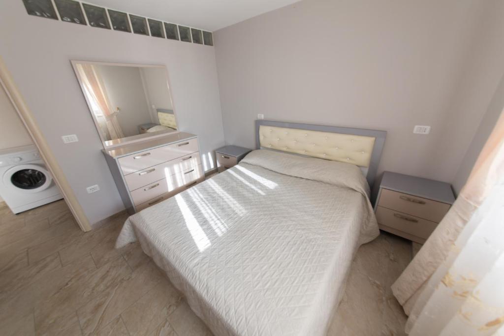 Postel nebo postele na pokoji v ubytování Apartments Qerret