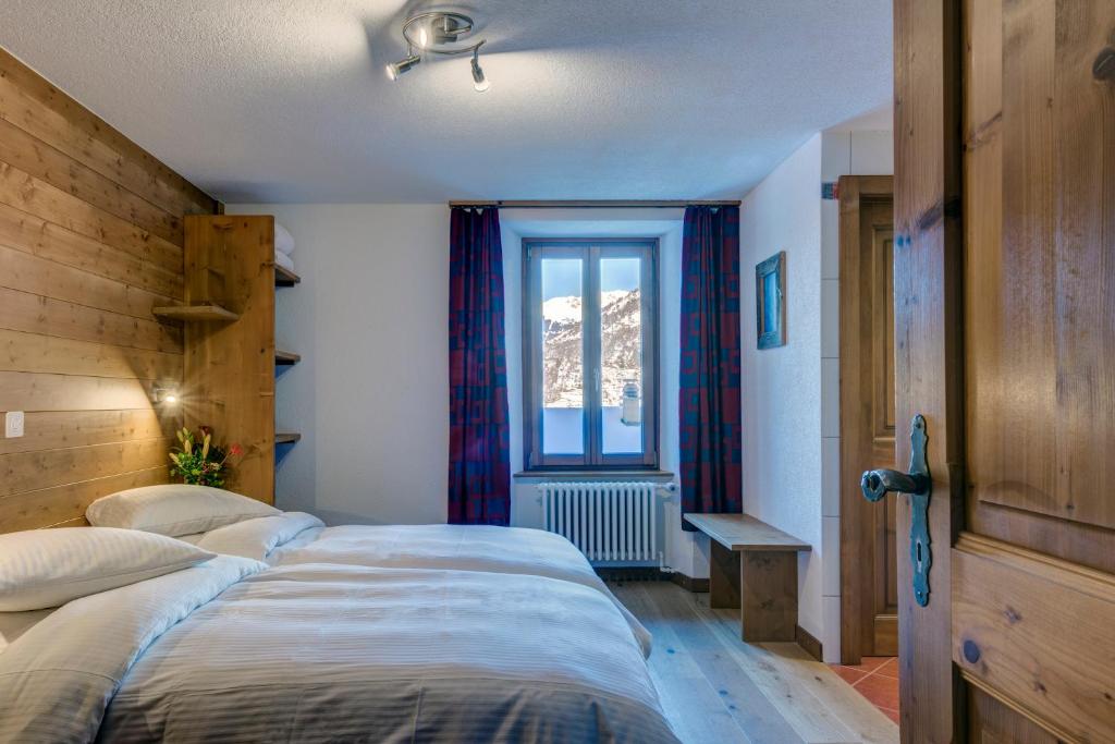 Postel nebo postele na pokoji v ubytování La Vallée Hôtel &Spa