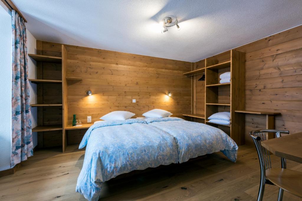 Postel nebo postele na pokoji v ubytování La Vallée Hôtel &Spa