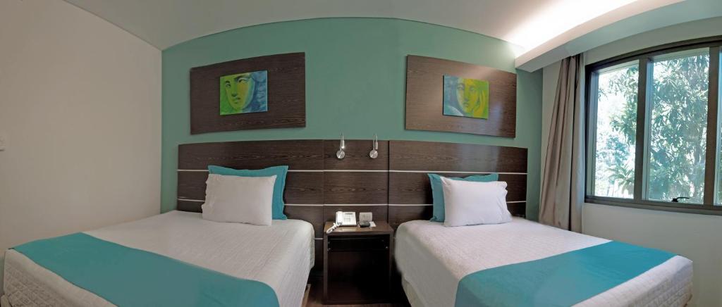 Postel nebo postele na pokoji v ubytování Awa Resort Hotel