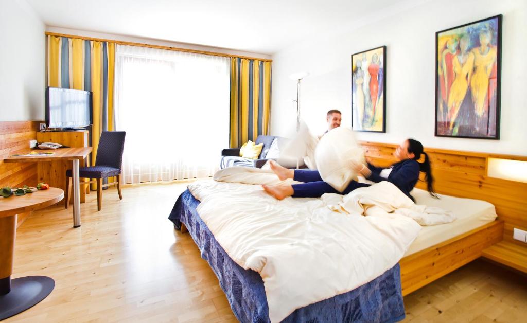 Postel nebo postele na pokoji v ubytování Hotel Binggl