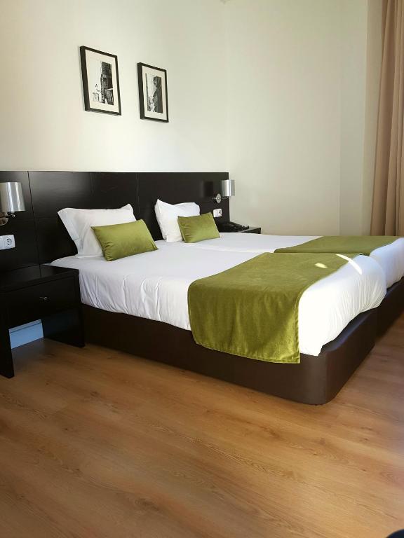 A bed or beds in a room at Lisbon City Hotel by City Hotels