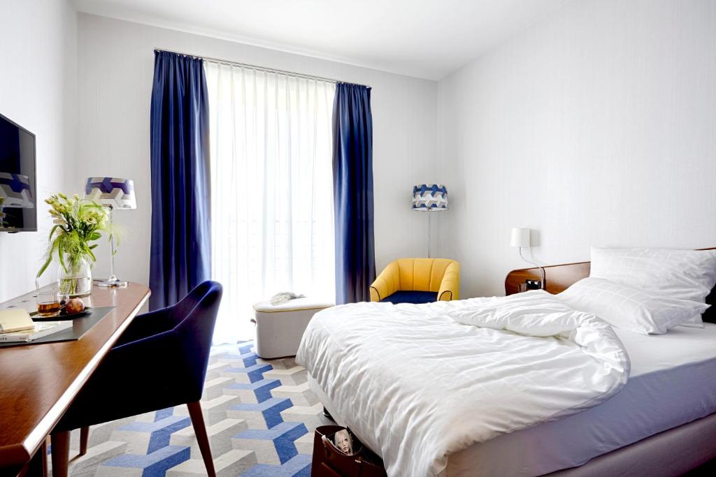Postel nebo postele na pokoji v ubytování Seaside Park Hotel Leipzig