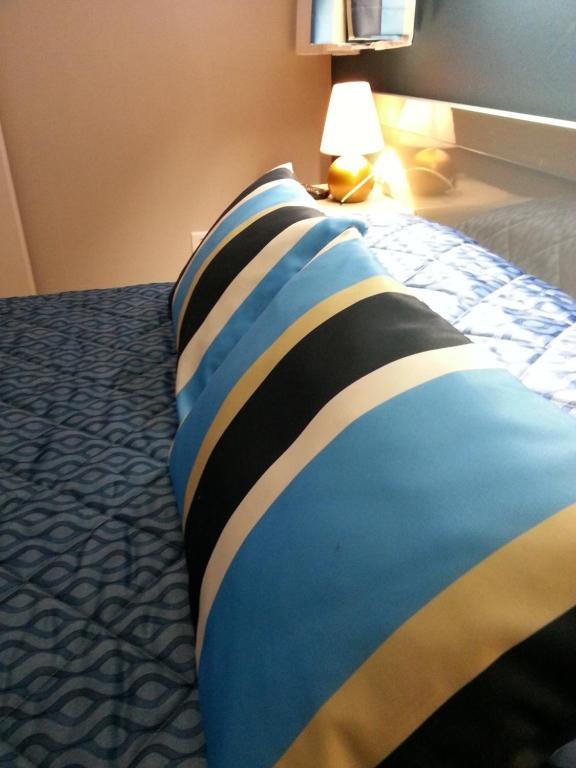 Postel nebo postele na pokoji v ubytování Hôtel Beach