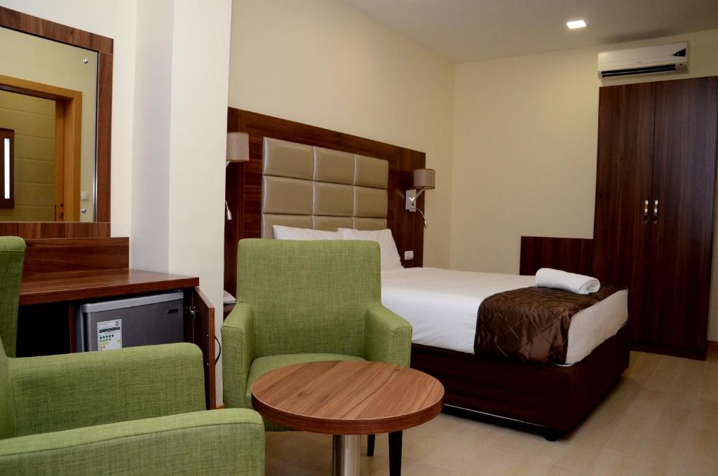 Voodi või voodid majutusasutuse Blu Sky Hotel toas
