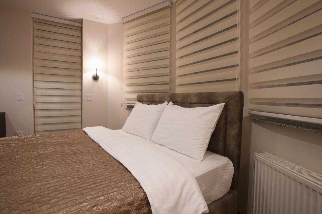 Postel nebo postele na pokoji v ubytování Apartmani Brocat