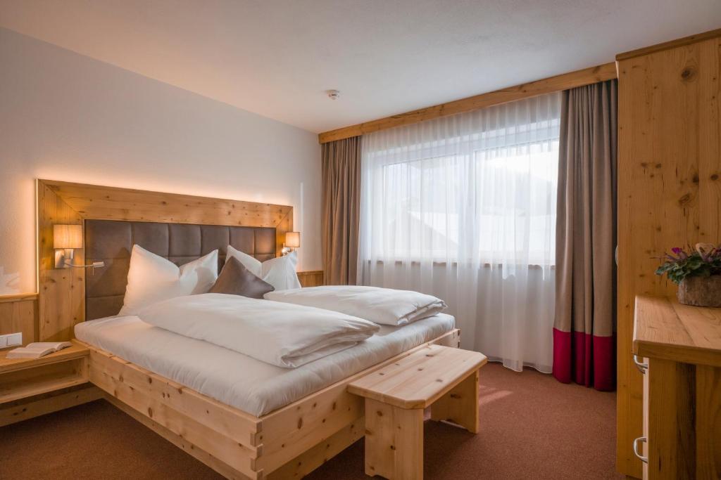 Postel nebo postele na pokoji v ubytování Postgasthof Fischerwirt