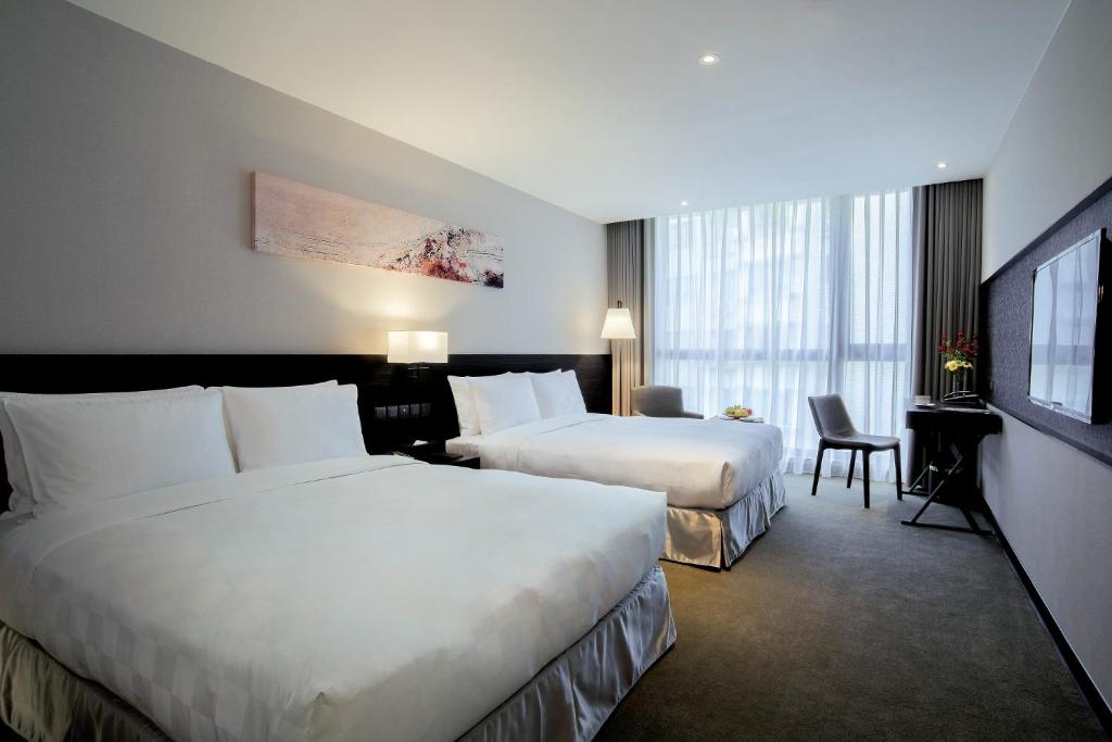 Postel nebo postele na pokoji v ubytování Platinum Hotel