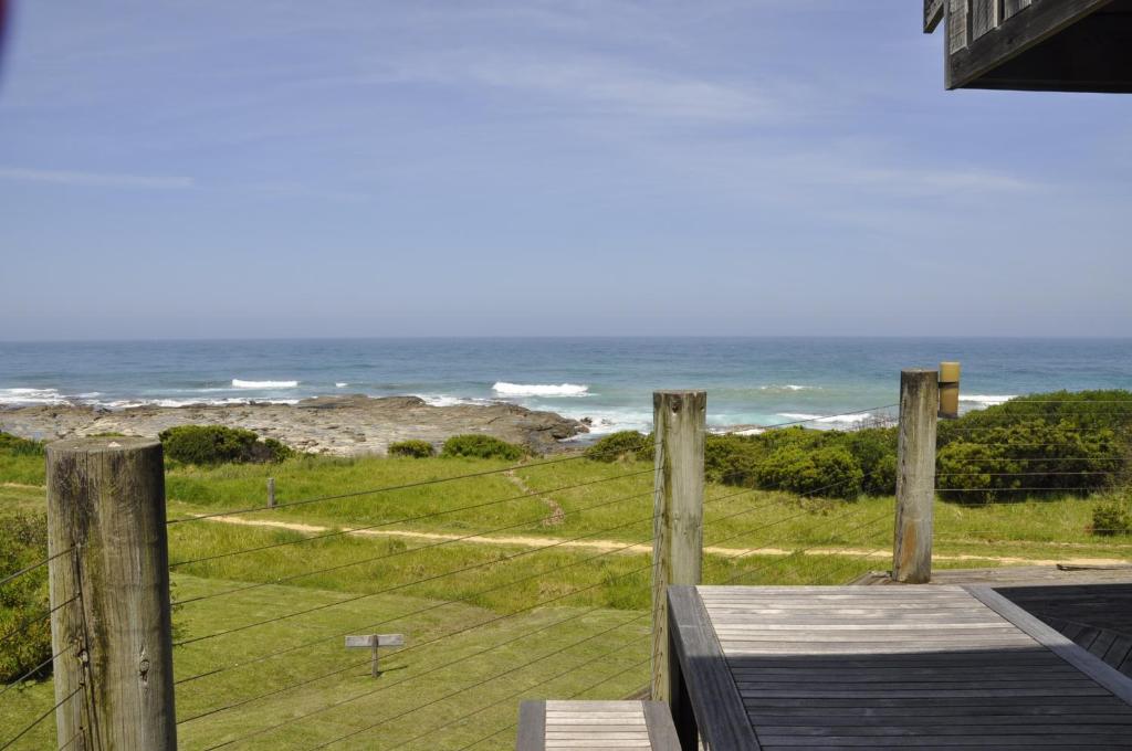 a view of the ocean from the porch of a house at 14 Steps in Marengo