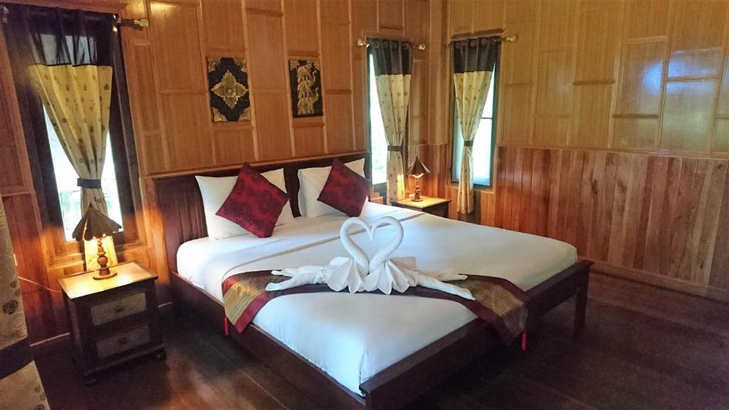 Postel nebo postele na pokoji v ubytování Macura Resort