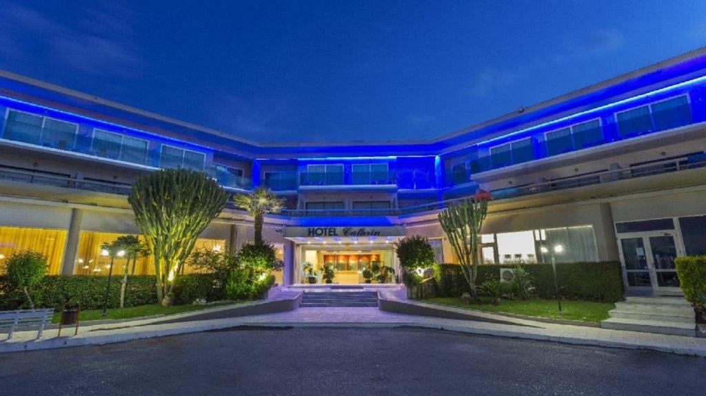 a building with blue lights on the front of it at Cathrin Hotel in Faliraki