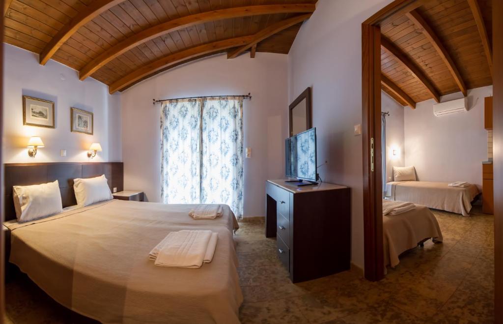 A bed or beds in a room at Villa Vasso