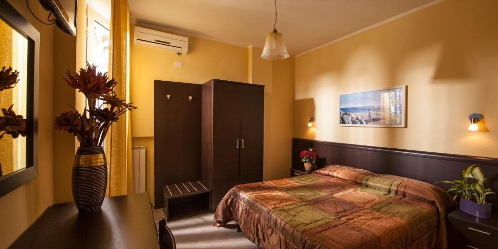Postel nebo postele na pokoji v ubytování Hotel Il Cavaliere Nero
