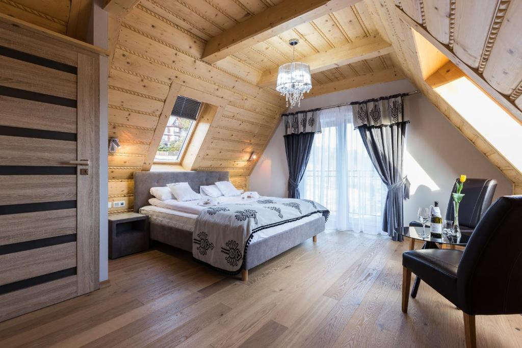Posteľ alebo postele v izbe v ubytovaní Giewont Residence
