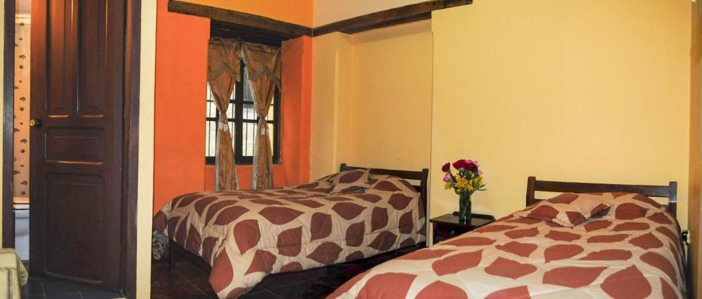 Postel nebo postele na pokoji v ubytování La Posada Colonial