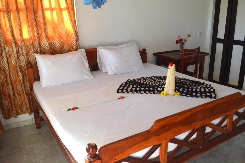 Postel nebo postele na pokoji v ubytování Lonely Beach Resort Tangalle