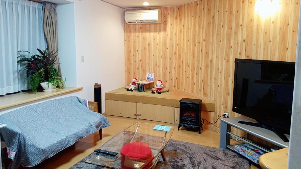 TV a/nebo společenská místnost v ubytování Villa M Guesthouse