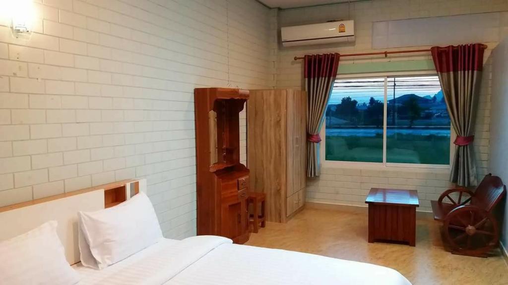 Postel nebo postele na pokoji v ubytování Three Bays Resort