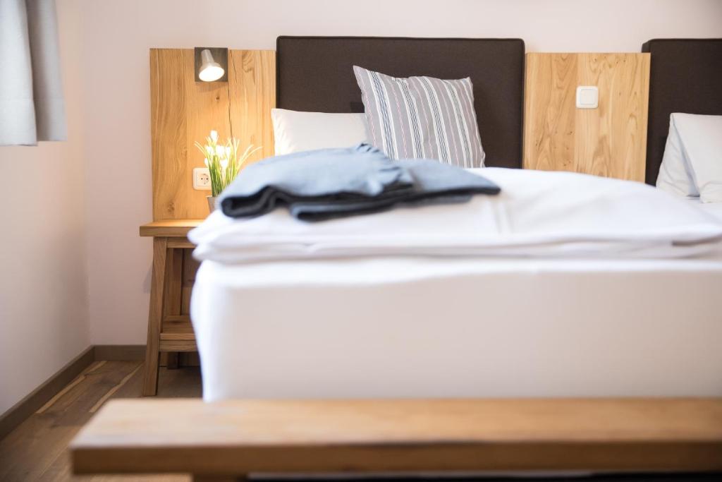 Postel nebo postele na pokoji v ubytování Hotel Moserwirt