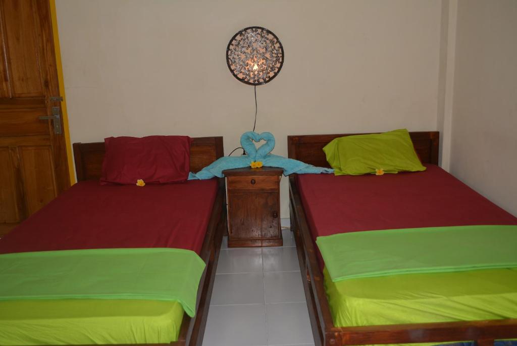 Postel nebo postele na pokoji v ubytování Repag Wayan Canggu Hostel
