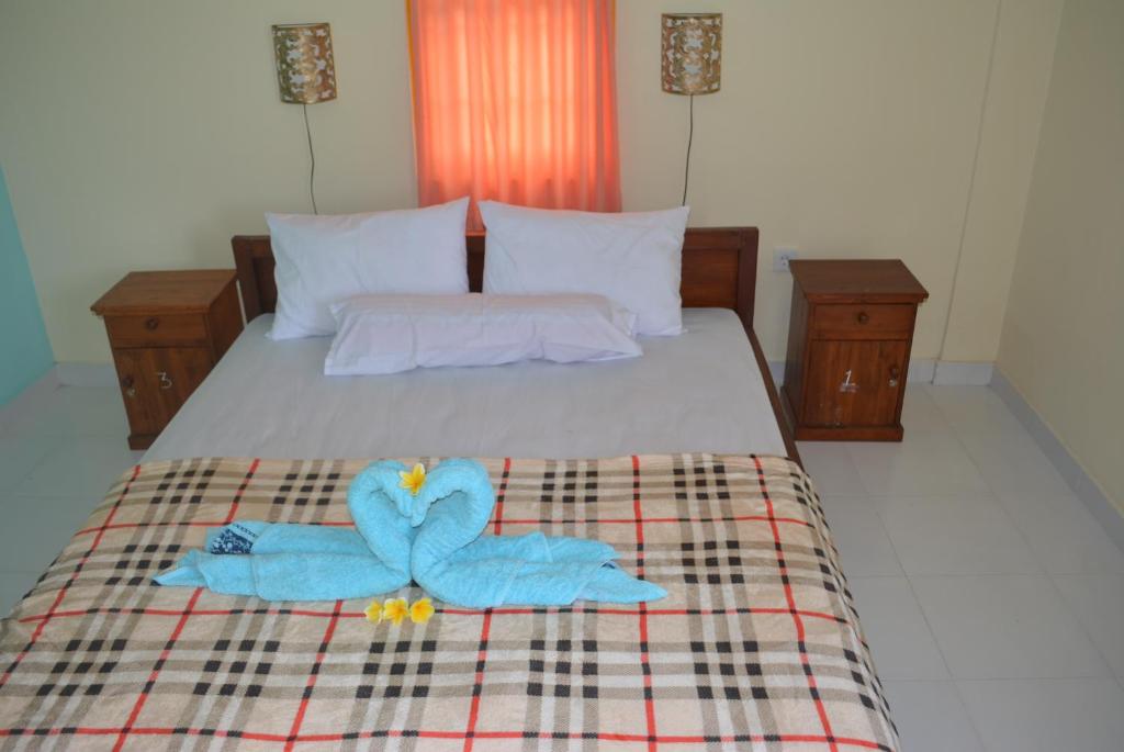 Postel nebo postele na pokoji v ubytování Repag Wayan Canggu Hostel