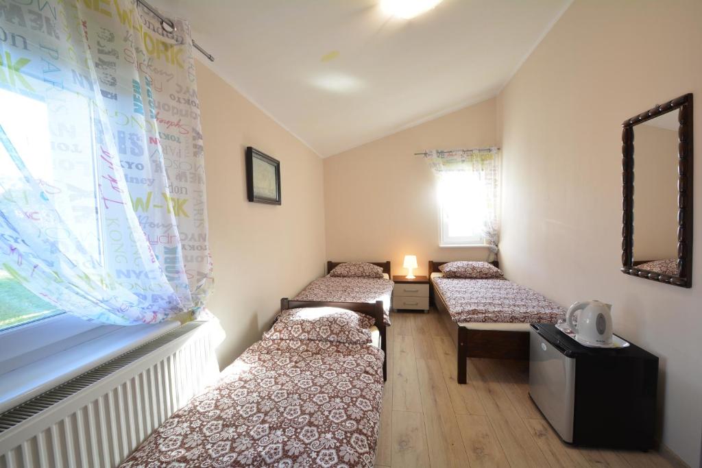 Postel nebo postele na pokoji v ubytování Pod Kasztanem