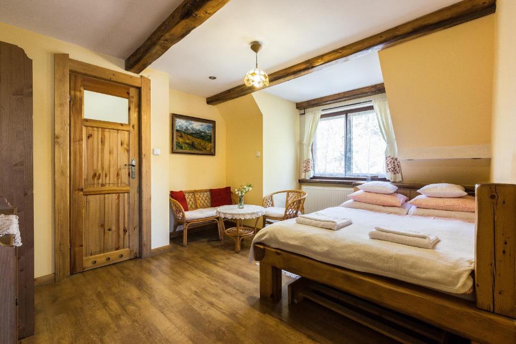 Posteľ alebo postele v izbe v ubytovaní Apartamenty Szymaszkowa