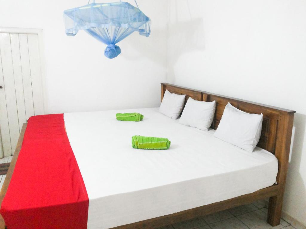 Postel nebo postele na pokoji v ubytování Jayaru Guest House