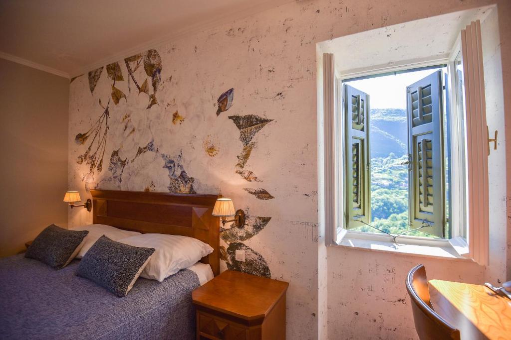 Postel nebo postele na pokoji v ubytování Hotel Draga di Lovrana
