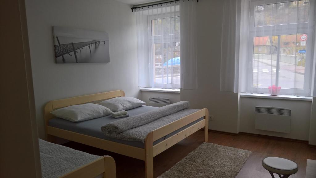 Postel nebo postele na pokoji v ubytování Apartmány Lípa