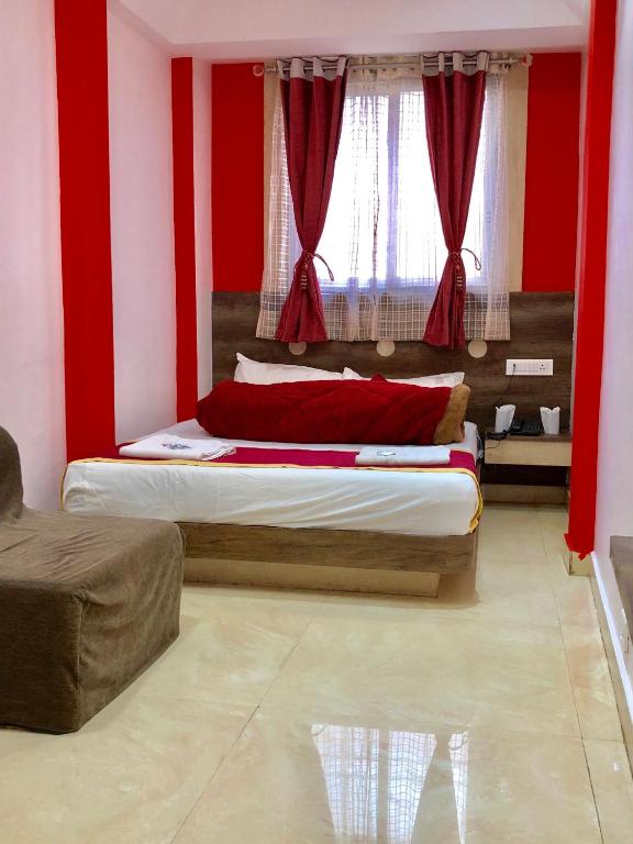 Postel nebo postele na pokoji v ubytování Hotel Landmark