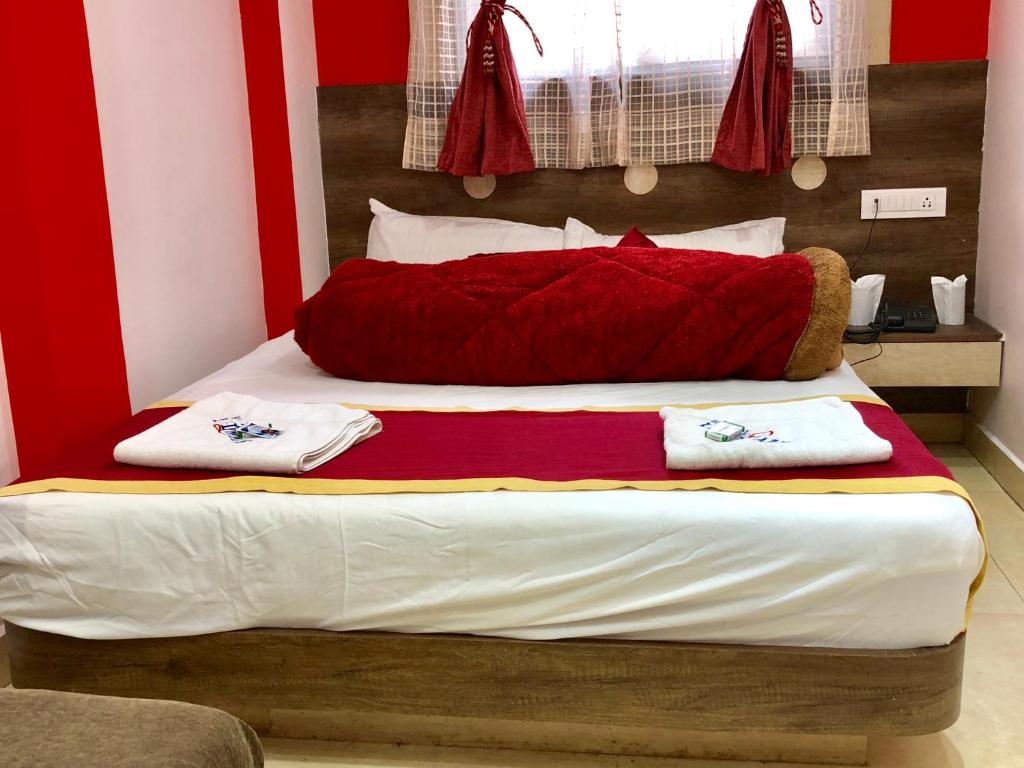 Postel nebo postele na pokoji v ubytování Hotel Landmark