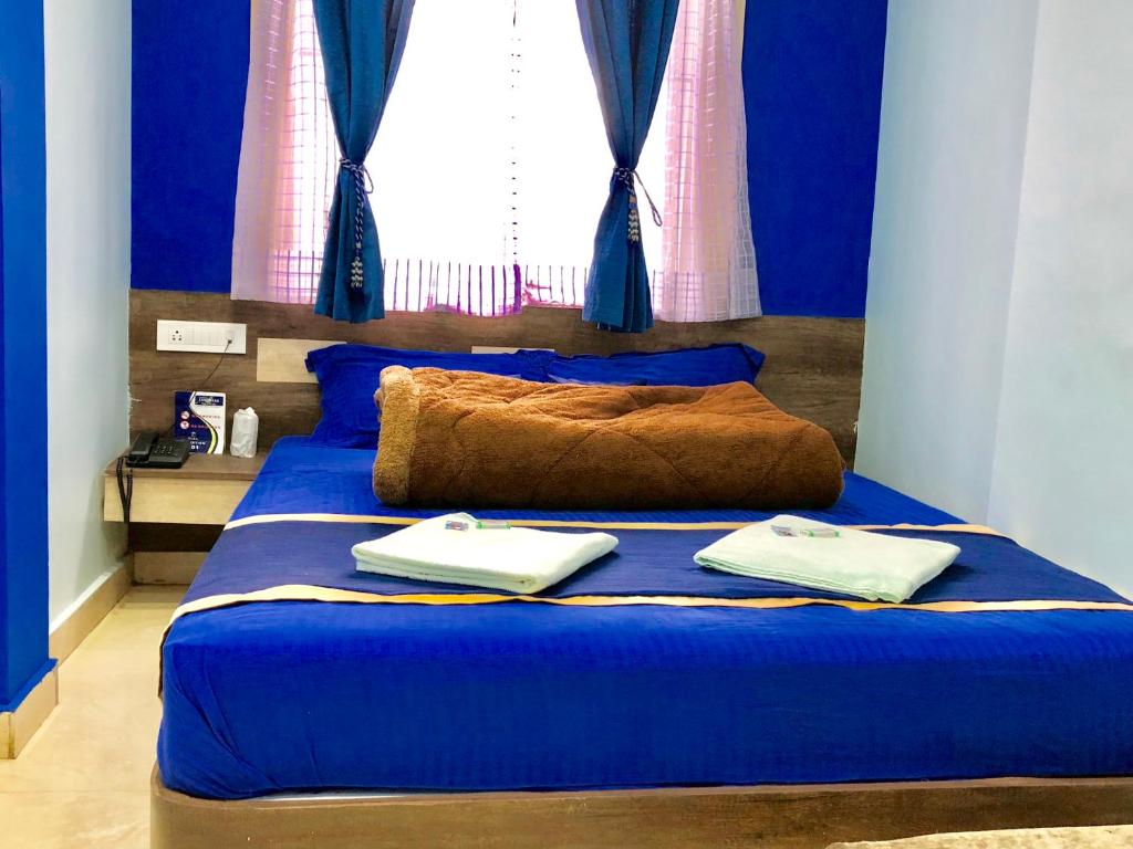 Postel nebo postele na pokoji v ubytování Hotel Landmark