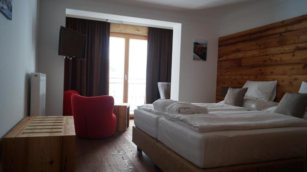 Postel nebo postele na pokoji v ubytování Hotel Binggl