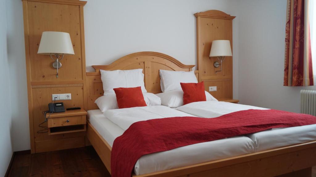 Postel nebo postele na pokoji v ubytování Hotel Binggl