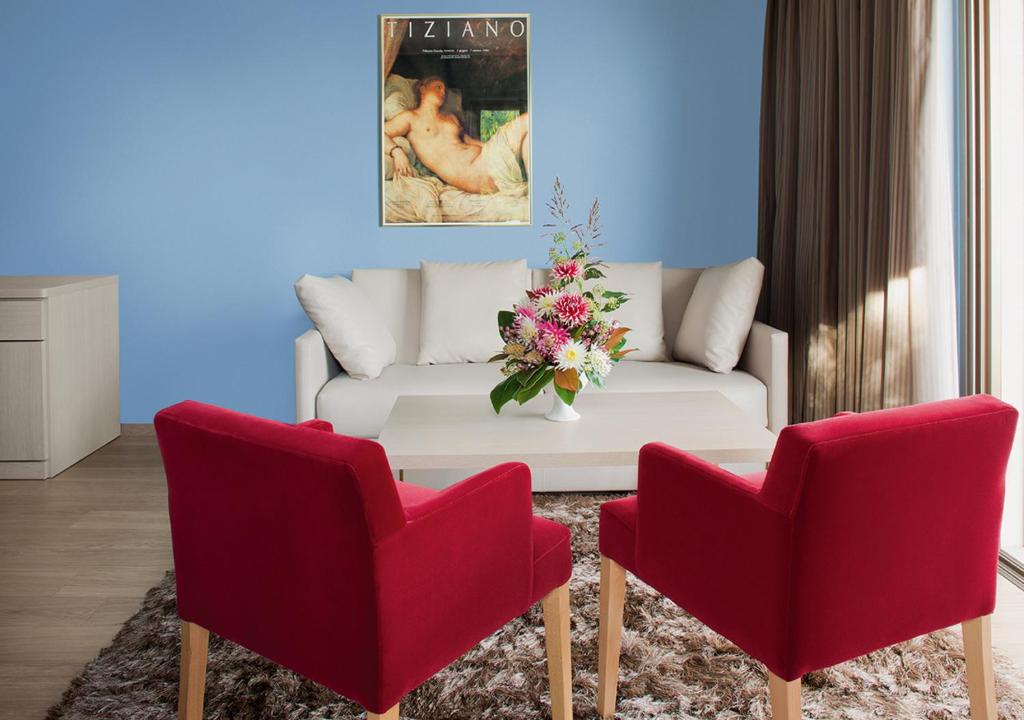 Uma área de estar em Hotel Ascona