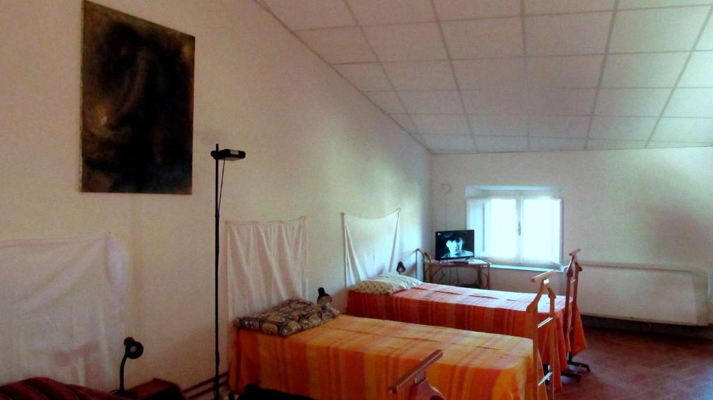 Postel nebo postele na pokoji v ubytování Casa Cordati