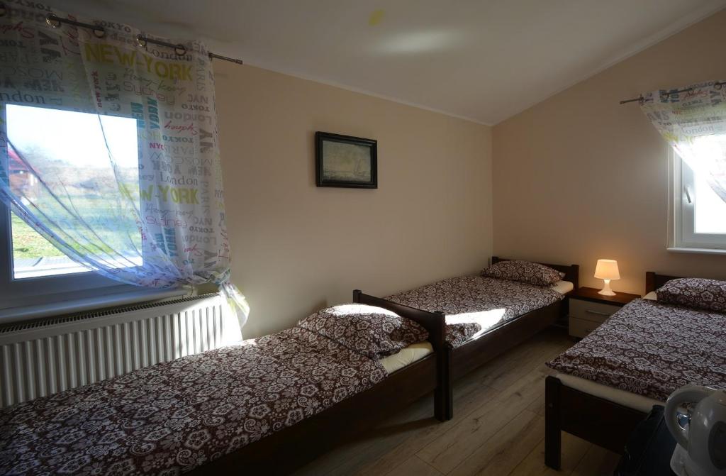 Postel nebo postele na pokoji v ubytování Pod Kasztanem