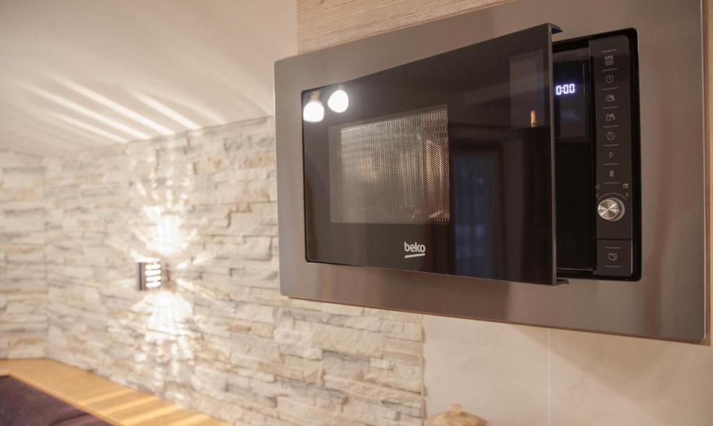 Televízia a/alebo spoločenská miestnosť v ubytovaní Appartment Salino