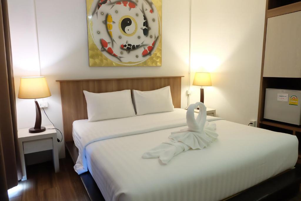 Llit o llits en una habitació de A Plus Hotel