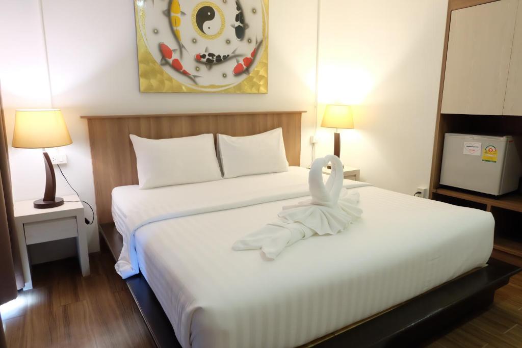 Llit o llits en una habitació de A Plus Hotel