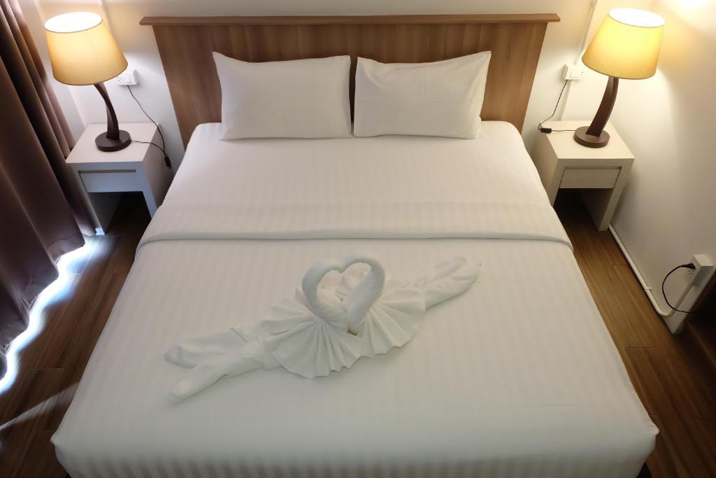 Llit o llits en una habitació de A Plus Hotel