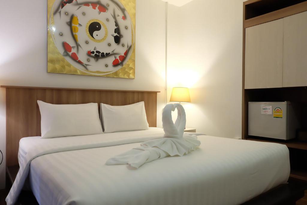 Llit o llits en una habitació de A Plus Hotel