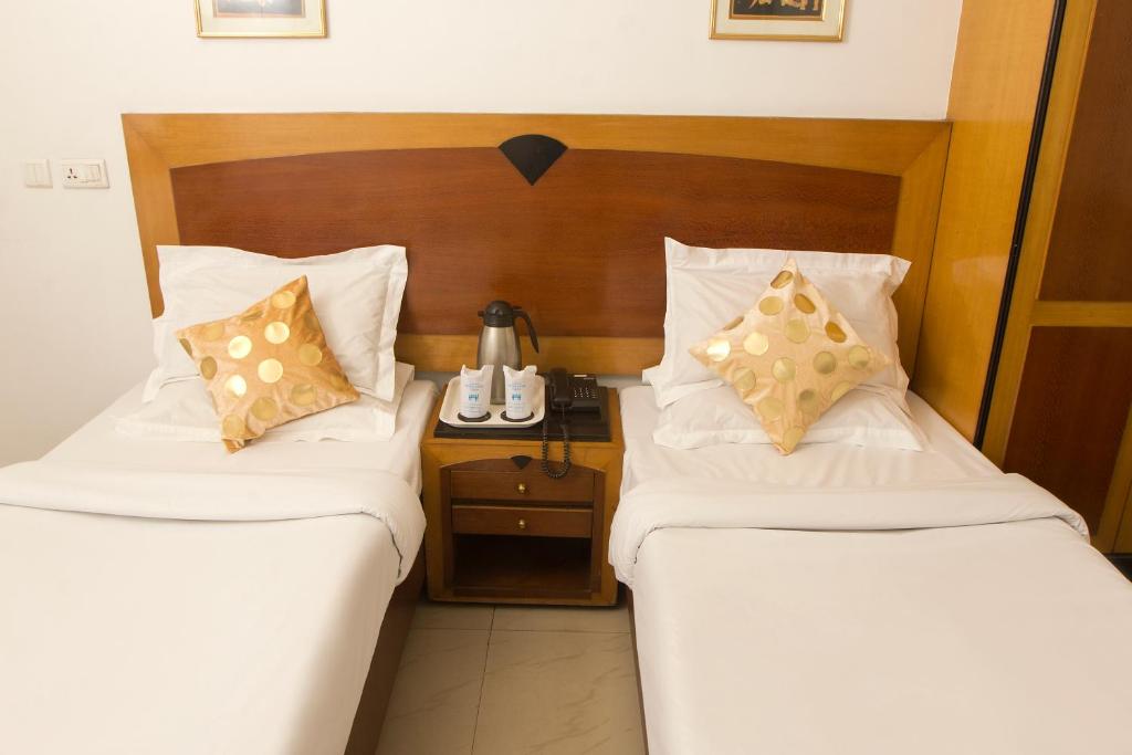 Postel nebo postele na pokoji v ubytování Hotel White House