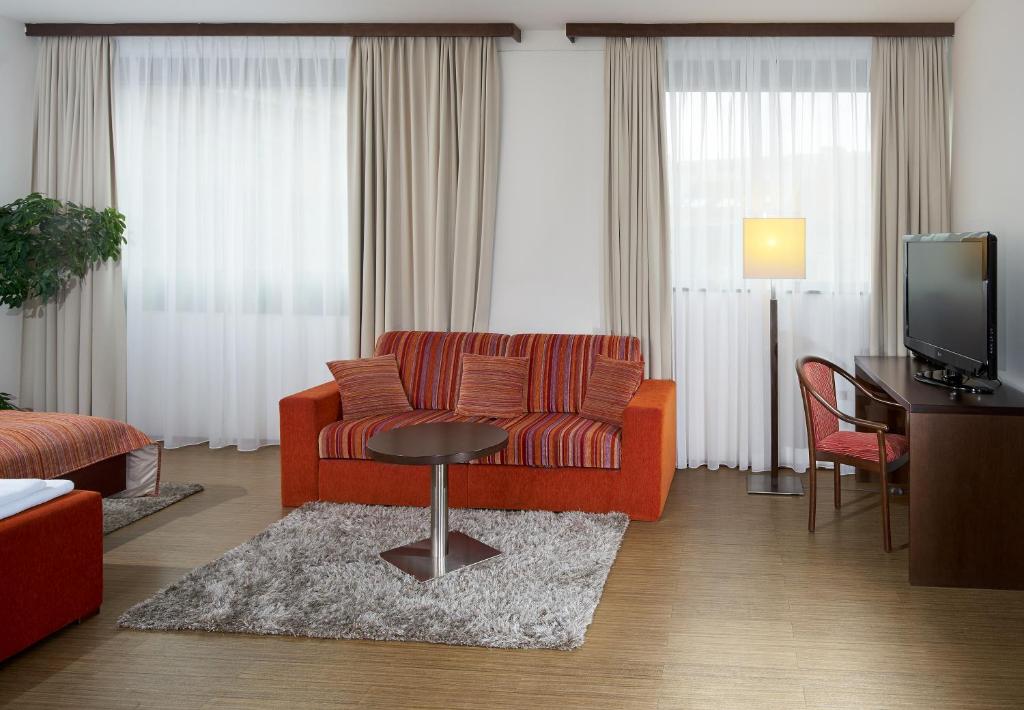 TV a/nebo společenská místnost v ubytování Hotel Ankora