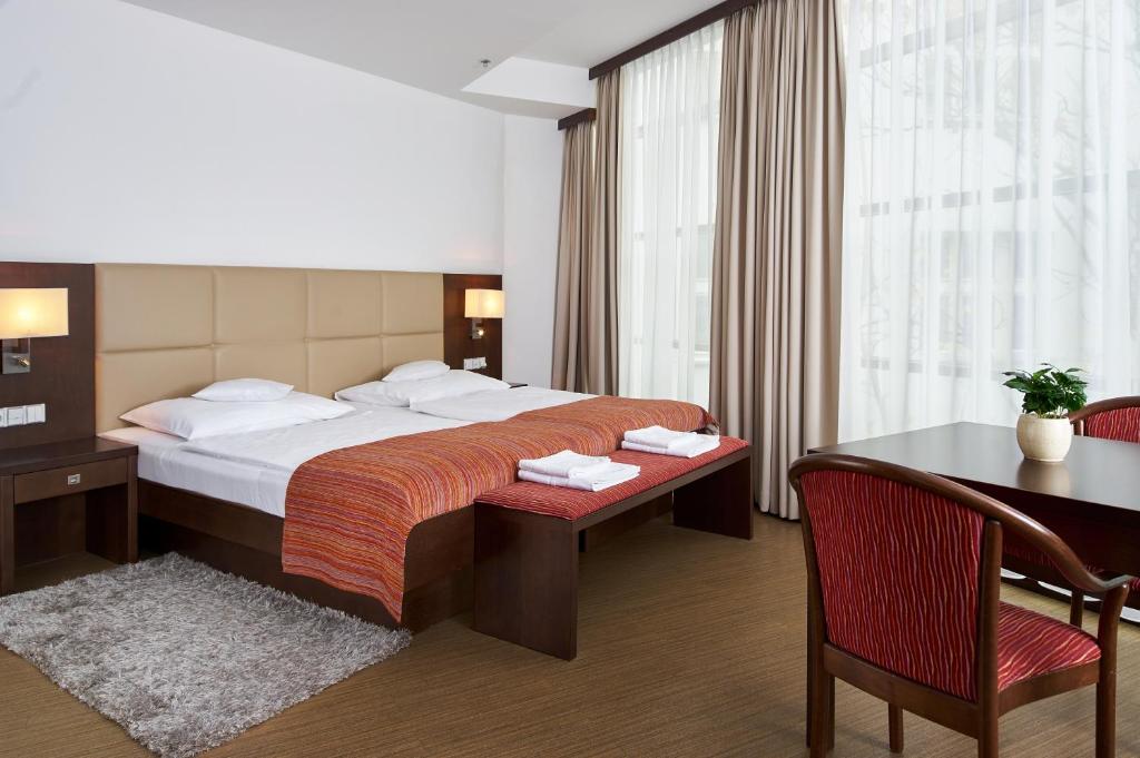 Postel nebo postele na pokoji v ubytování Hotel Ankora