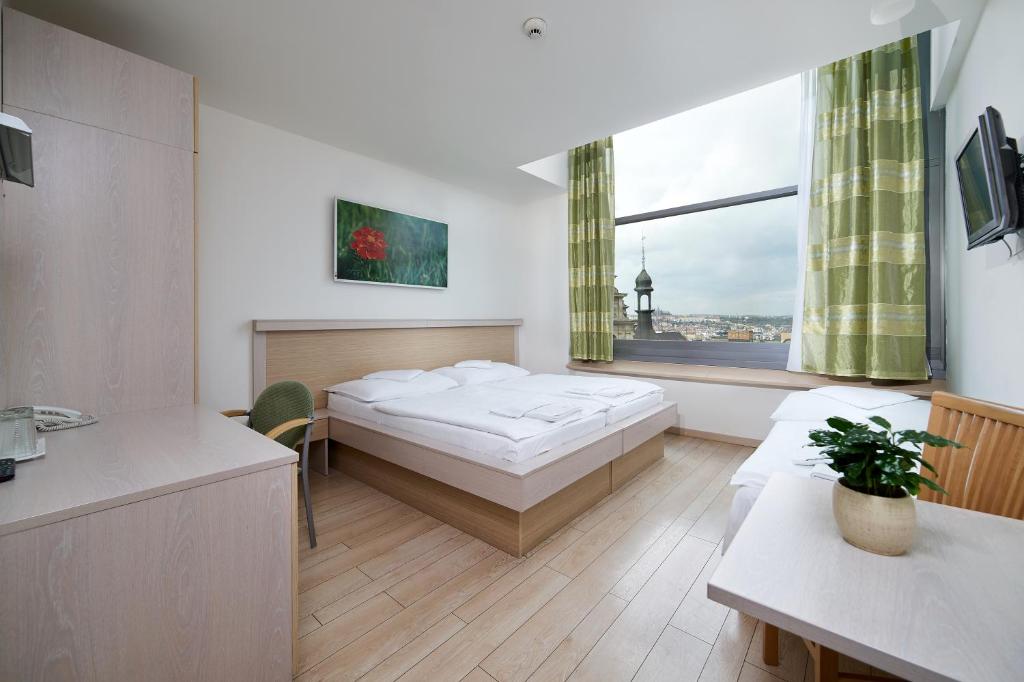 Postel nebo postele na pokoji v ubytování Hotel Ankora
